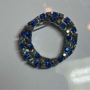 Vintage double circle brooch. blue stones.